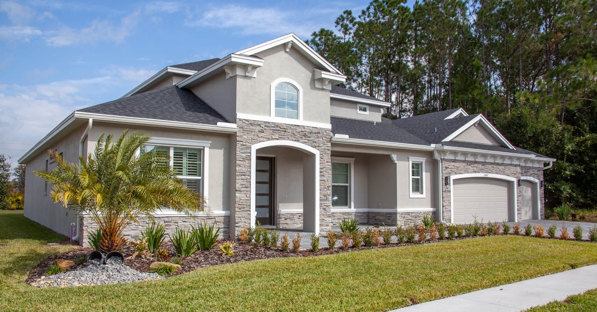 Beautiful modern suburban house in Odessa, FL with lush garden and clear blue sky.