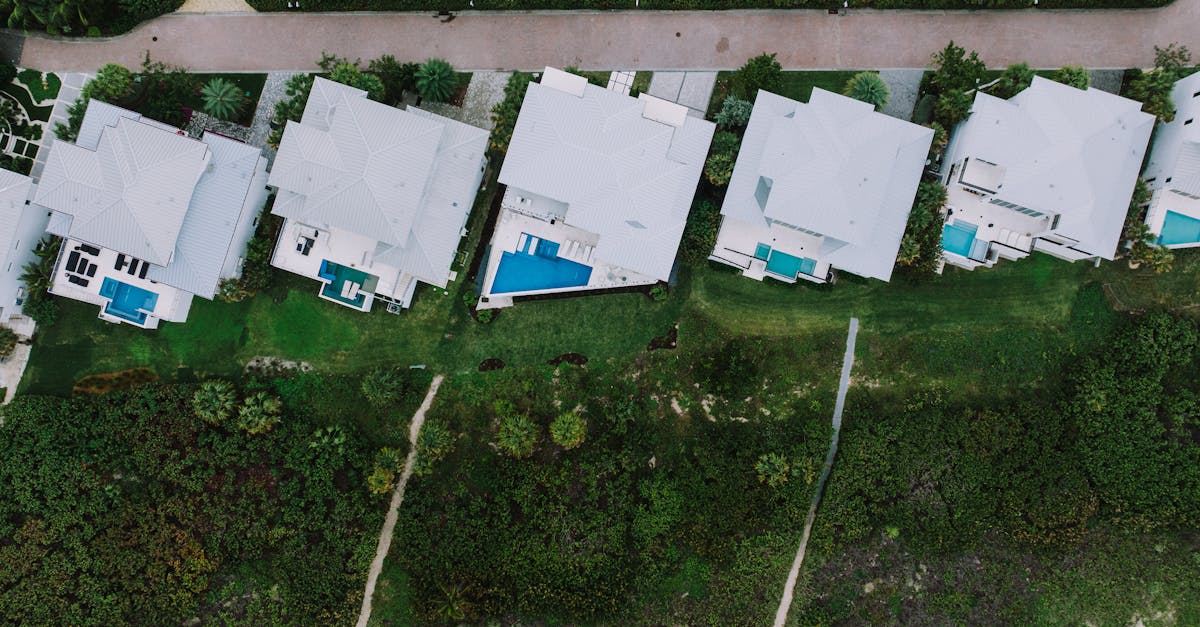 Aerial shot showcasing modern homes with pools in Fort Pierce, Florida neighborhood.